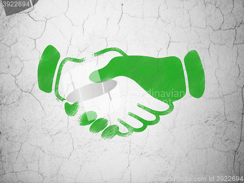 Image of Politics concept: Handshake on wall background