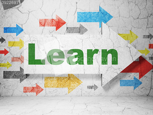 Image of Learning concept: arrow with Learn on grunge wall background