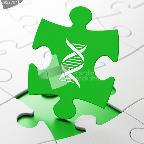 Image of Science concept: DNA on puzzle background