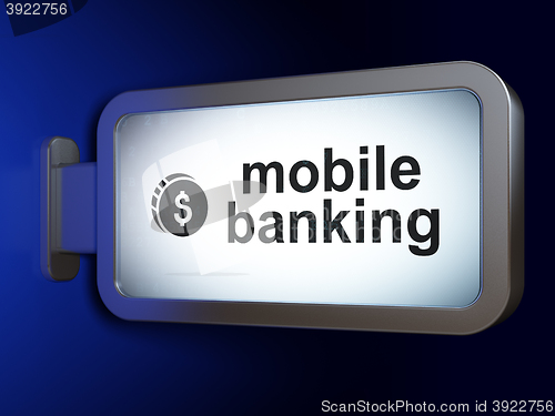 Image of Currency concept: Mobile Banking and Dollar Coin on billboard background