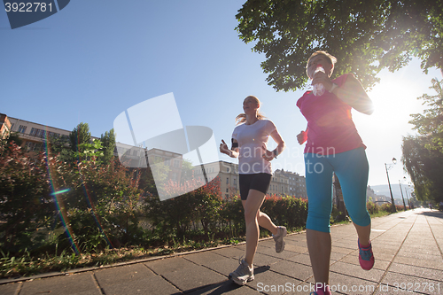 Image of female friends jogging