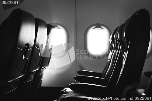 Image of Airplane seat and window inside an aircraft