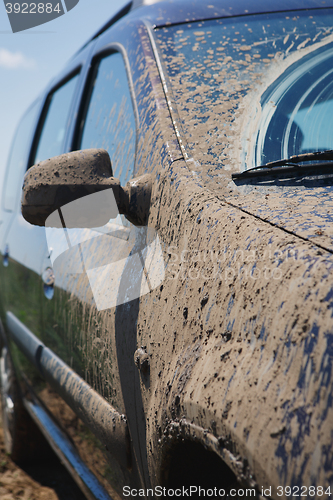 Image of car covered in dirt