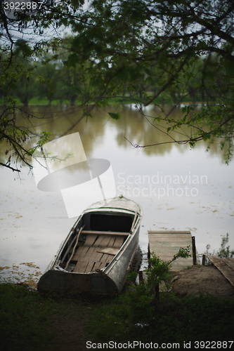 Image of the boat was moored to the banks of the river