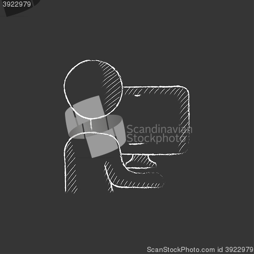 Image of Man working at his computer. Drawn in chalk icon.
