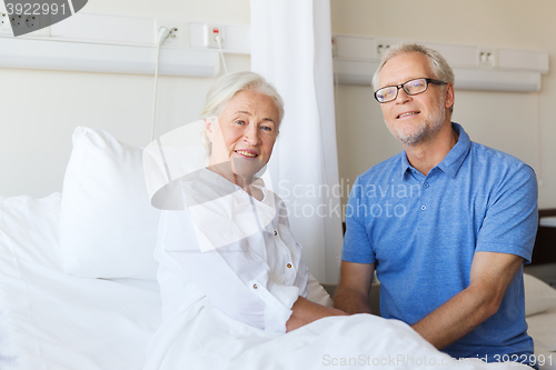 Image of senior couple meeting at hospital ward