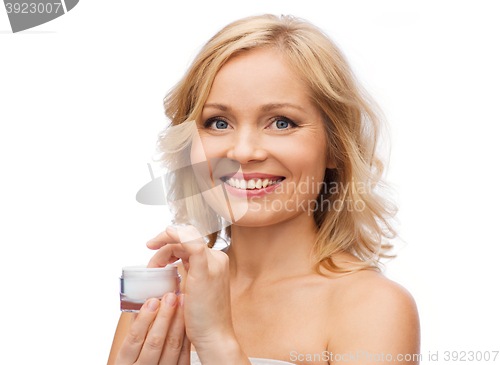 Image of happy woman with cream jar