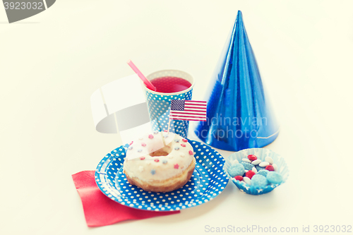 Image of donut with juice and candies on independence day