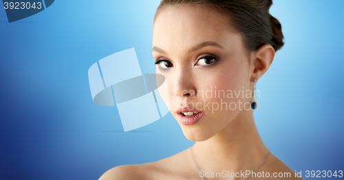 Image of close up of beautiful woman face with earring