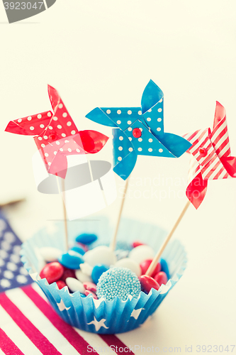 Image of candies with pinwheel toys on independence day