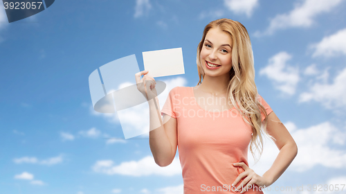 Image of happy woman or teen girl with blank white paper