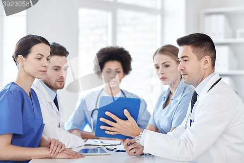 Image of group of happy doctors meeting at hospital office