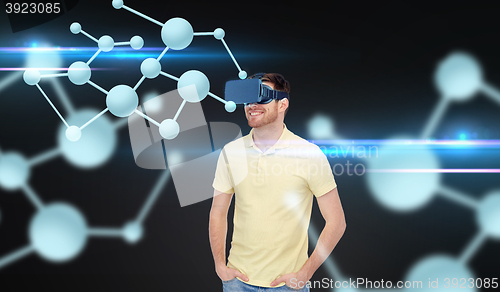 Image of happy man in virtual reality headset or 3d glasses