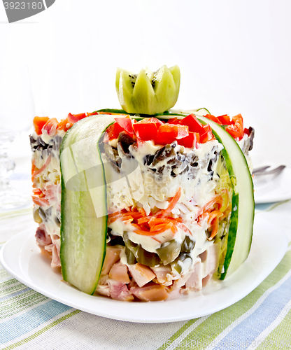 Image of Salad with chicken and peppers on striped napkin