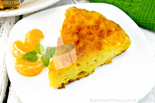 Image of Pie mandarin with mint and napkin on light board