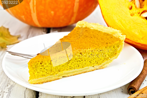 Image of Pie pumpkin in white plate on board