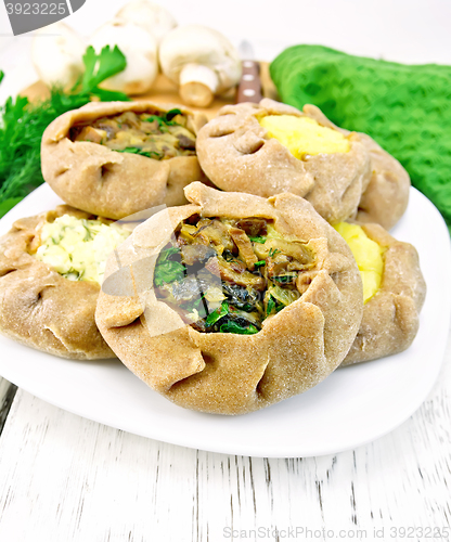 Image of Carols with different fillings and parsley on light board