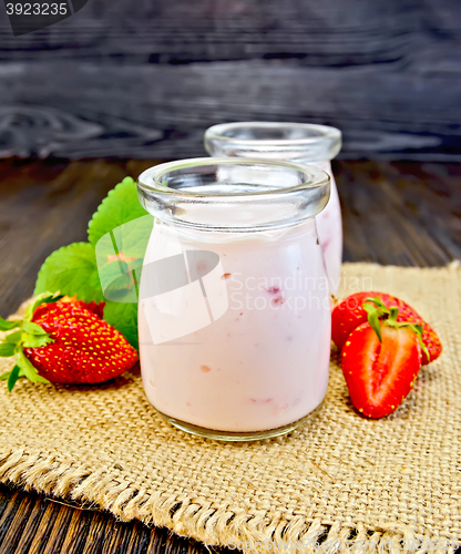 Image of Yogurt with strawberries and mint on sacking