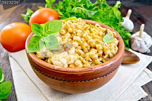 Image of Barley porridge with basil on board