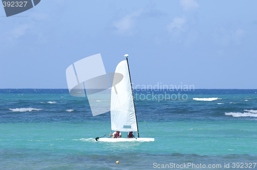 Image of Sailboat on the blue caribbean sea.