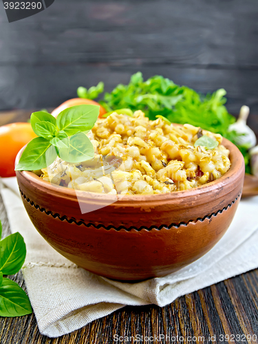 Image of Barley porridge with basil on napkin