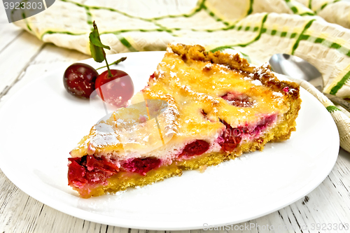 Image of Pie cherry with sour cream in white plate on board