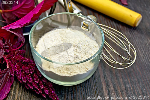 Image of Flour amaranth in cup with rolling pin on board