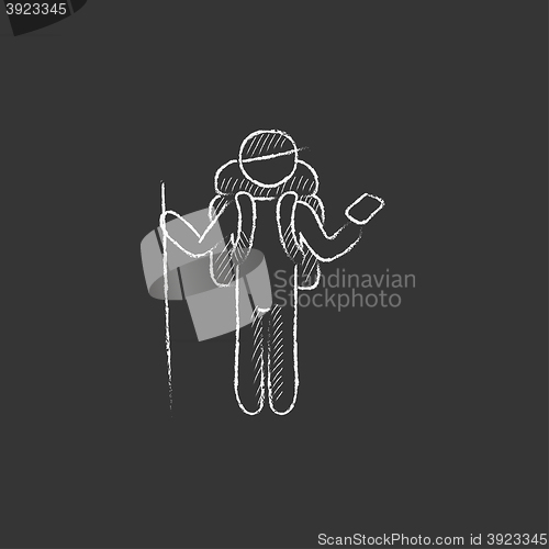 Image of Tourist backpacker with phone. Drawn in chalk icon.