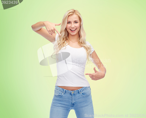 Image of happy young woman or teenage girl in white t-shirt