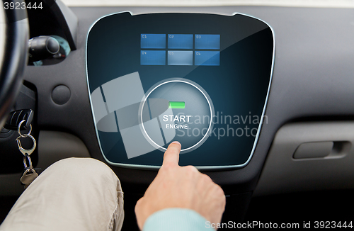Image of close up of man using starter application in car