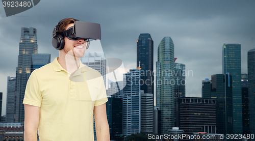 Image of happy man in virtual reality headset or 3d glasses