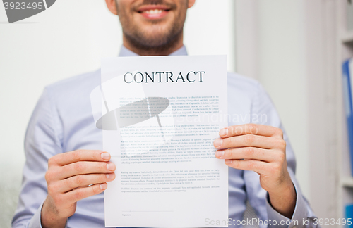 Image of close up of businessman holding contract document