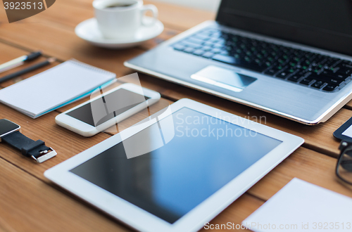 Image of close up of on laptop, tablet pc and smartphone