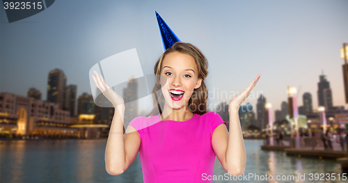 Image of happy young woman or teen girl in party cap