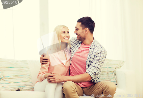 Image of smiling happy couple at home