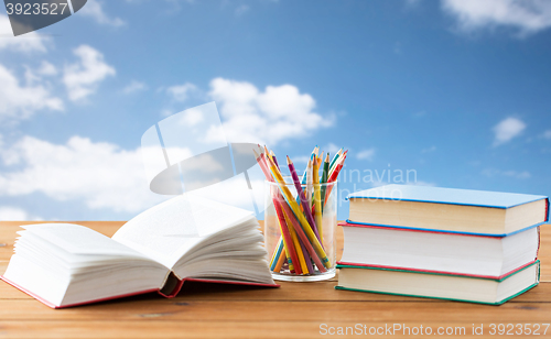 Image of close up of crayons or color pencils and books