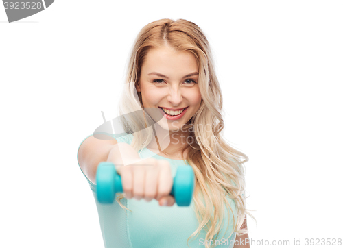 Image of smiling beautiful young sporty woman with dumbbell