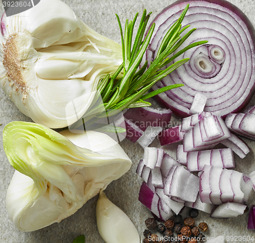 Image of fresh garlic, onion and rosemary