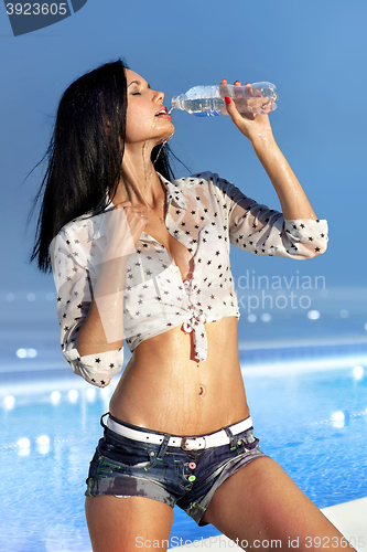 Image of woman drinks water from bottle