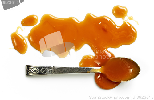 Image of caramel sauce on white background