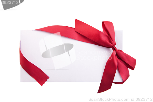 Image of Card note with red ribbon on white background