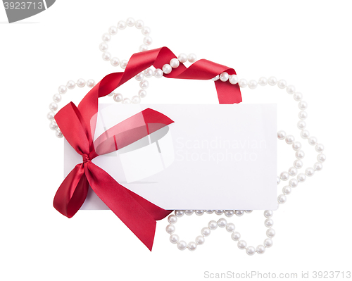 Image of Card note with red ribbon on white background