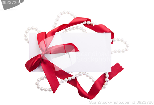 Image of Card note with red ribbon on white background