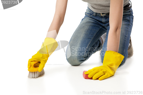 Image of Woman with sponge and scrub brush isolated