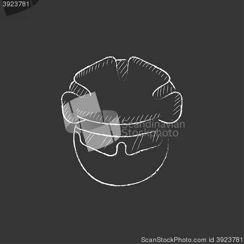 Image of Man in bicycle helmet and glasses. Drawn in chalk icon.