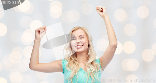 Image of happy young woman or teen girl celebrating victory