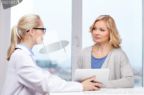 Image of doctor with tablet pc and ill woman at hospital