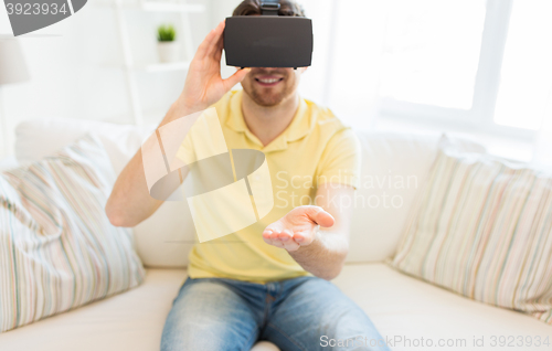 Image of young man in virtual reality headset or 3d glasses
