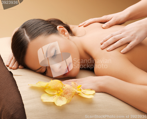 Image of beautiful woman in massage salon