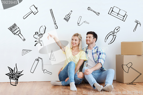 Image of couple with boxes moving to new home and dreaming